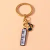 Alloy Metal Enamel Musical Keychain – Piano & Music Note Handbag Pendant Alloy Metal Enamel Musical Keychain – Piano & Music Note Handbag Pendant