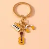 Alloy Metal Enamel Musical Keychain – Piano & Music Note Handbag Pendant Alloy Metal Enamel Musical Keychain – Piano & Music Note Handbag Pendant