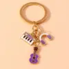 Alloy Metal Enamel Musical Keychain – Piano & Music Note Handbag Pendant Alloy Metal Enamel Musical Keychain – Piano & Music Note Handbag Pendant