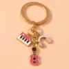 Alloy Metal Enamel Musical Keychain – Piano & Music Note Handbag Pendant Alloy Metal Enamel Musical Keychain – Piano & Music Note Handbag Pendant